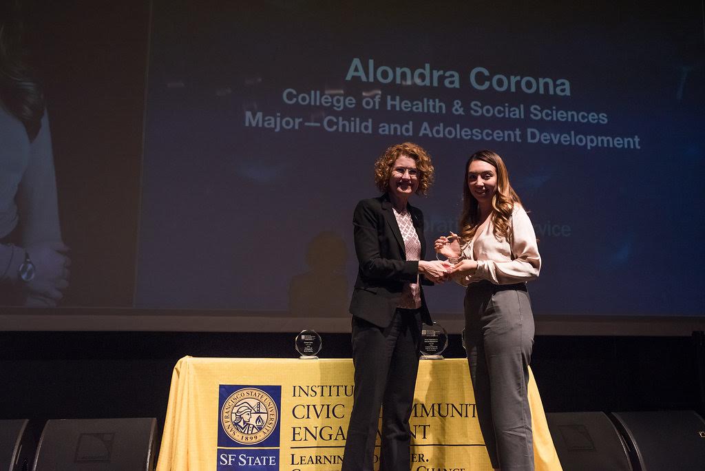 Alondra Corona receiving award