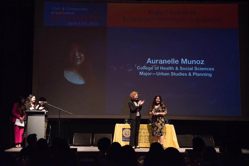 Auranelle Munoz receiving award