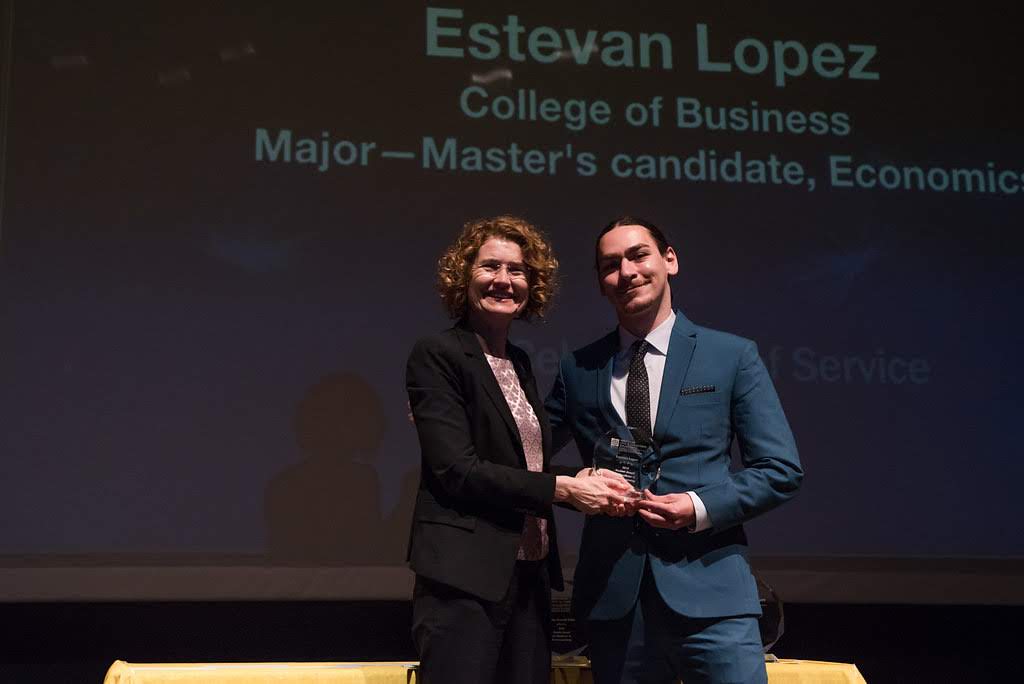 Estevan Lopez receiving award