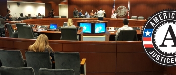 Meeting at Justice Corps city hall with logo